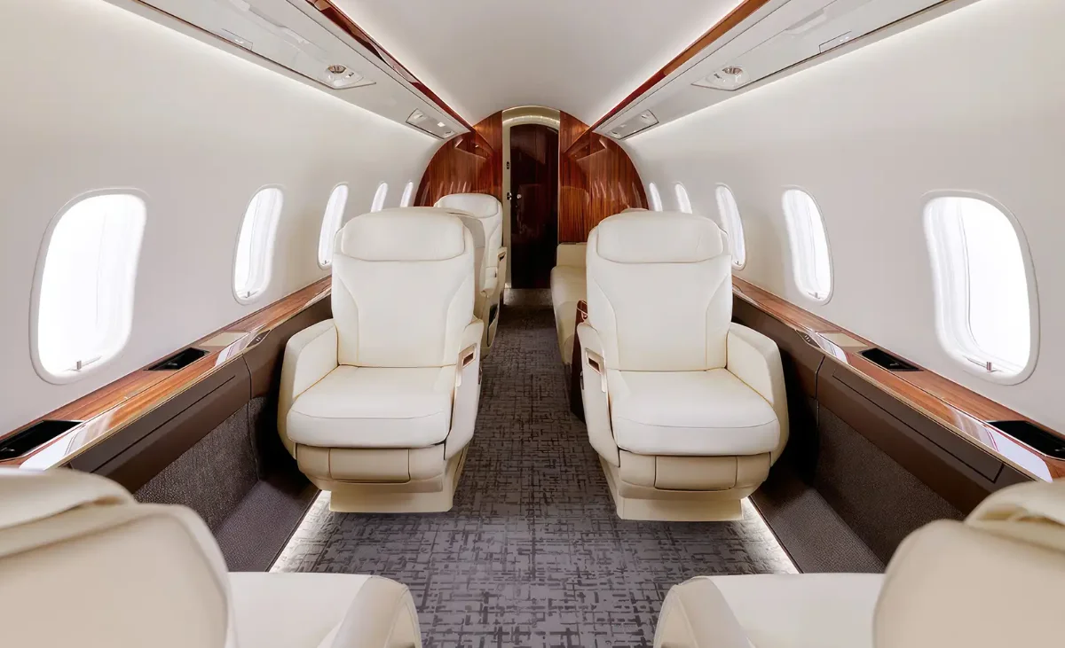 Large private jet cabin interior in warm light